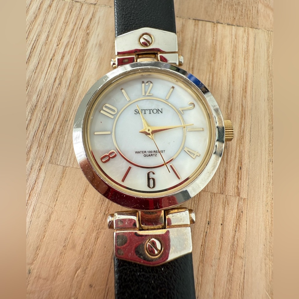 Sutton by Armitron ladies round gold tone black leather watch NEW BATTERY